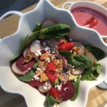 Beet, radish salad with baby spinach and strawberry mint dressing