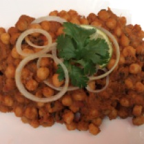 Chickpeas tossed with a delectable onion-tomato sauce.