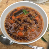Hearty lentil and black bean soup with carrots.
